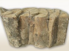 Dry birch firewood packed in 15kg net bag Birke Brennholz